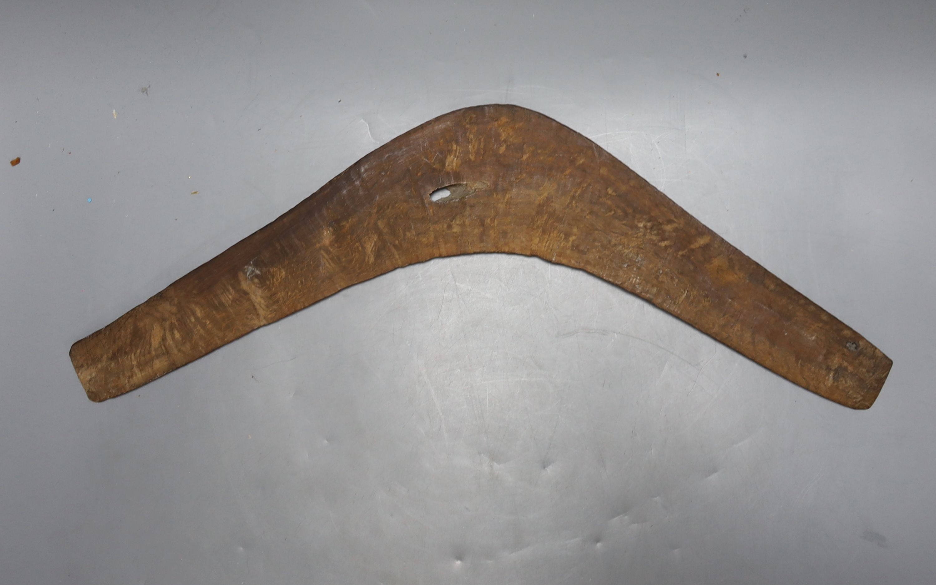 A carved wood boomerang, 19th/20th century, length 50cm